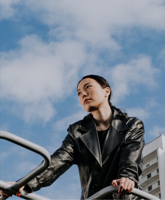 A woman against an open sky