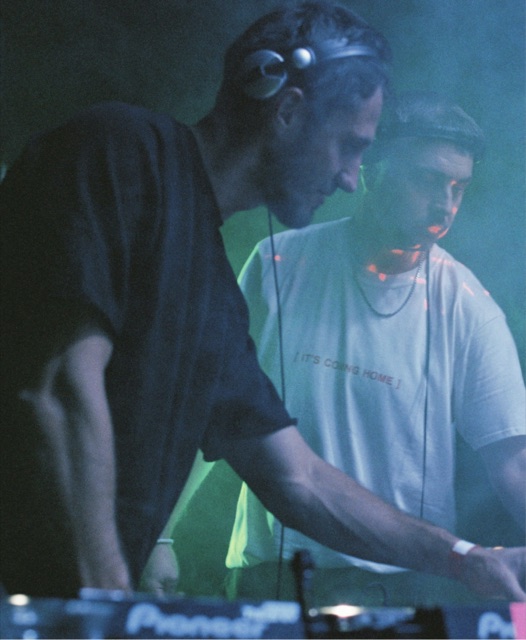 Two DJs behind the decks